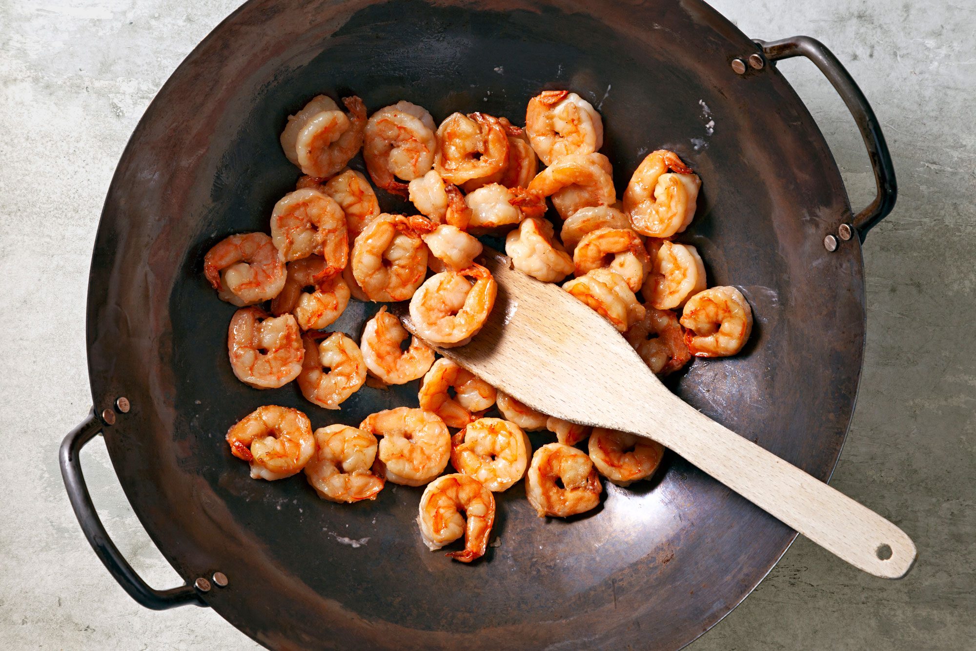 Heat 1 tablespoon oil in a large nonstick skillet and add shrimp until it turns pink