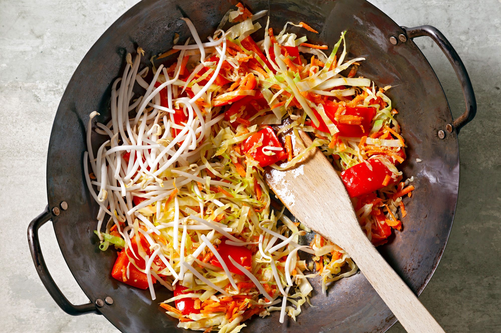 Add remaining 2 tablespoons oil to pan then add garlic and ginger. Cook and stir 1 minute then add cabbage, pepper, sprouts and carrot