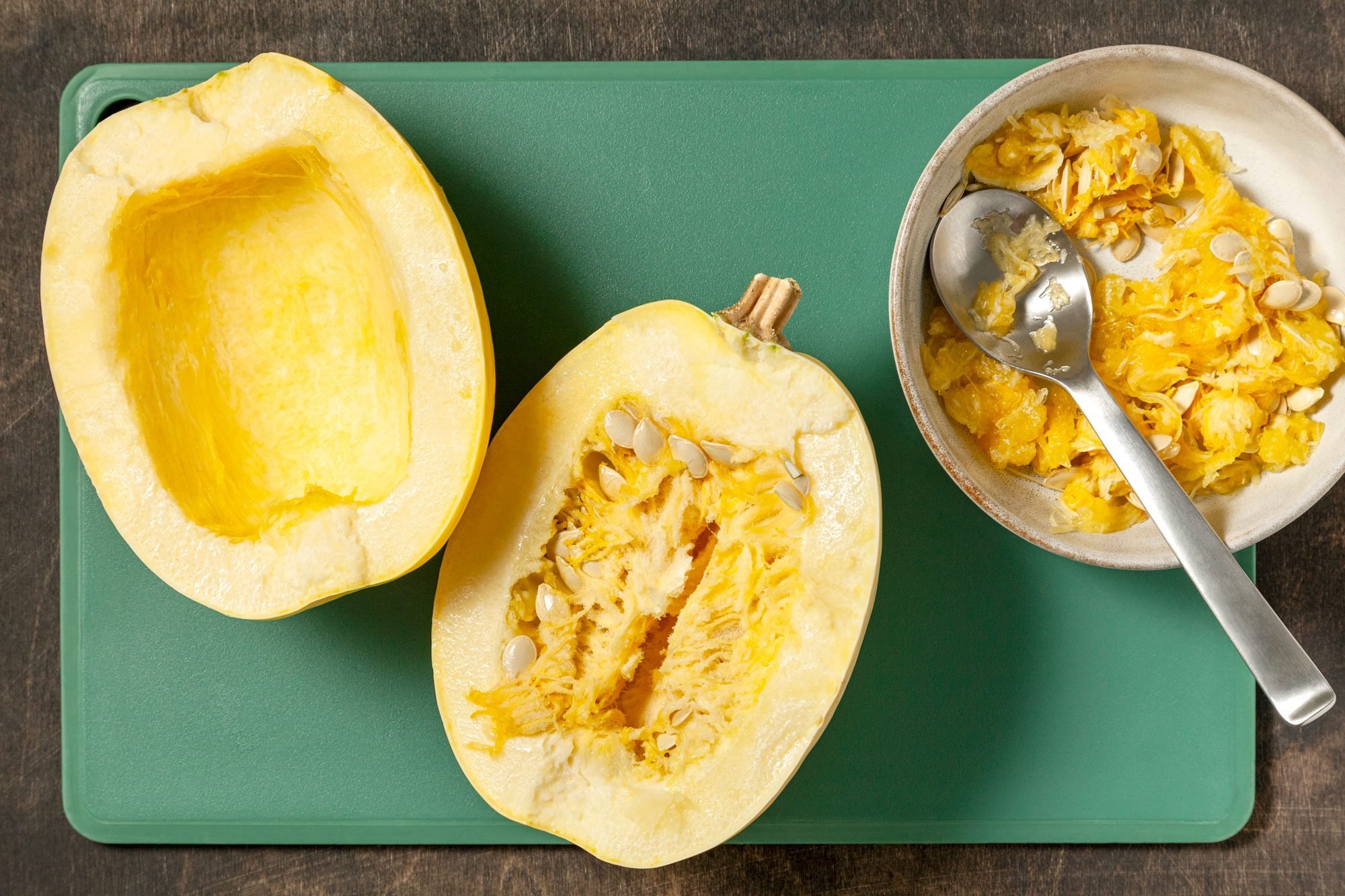 Cut squash in half lengthwise; scoop out seeds