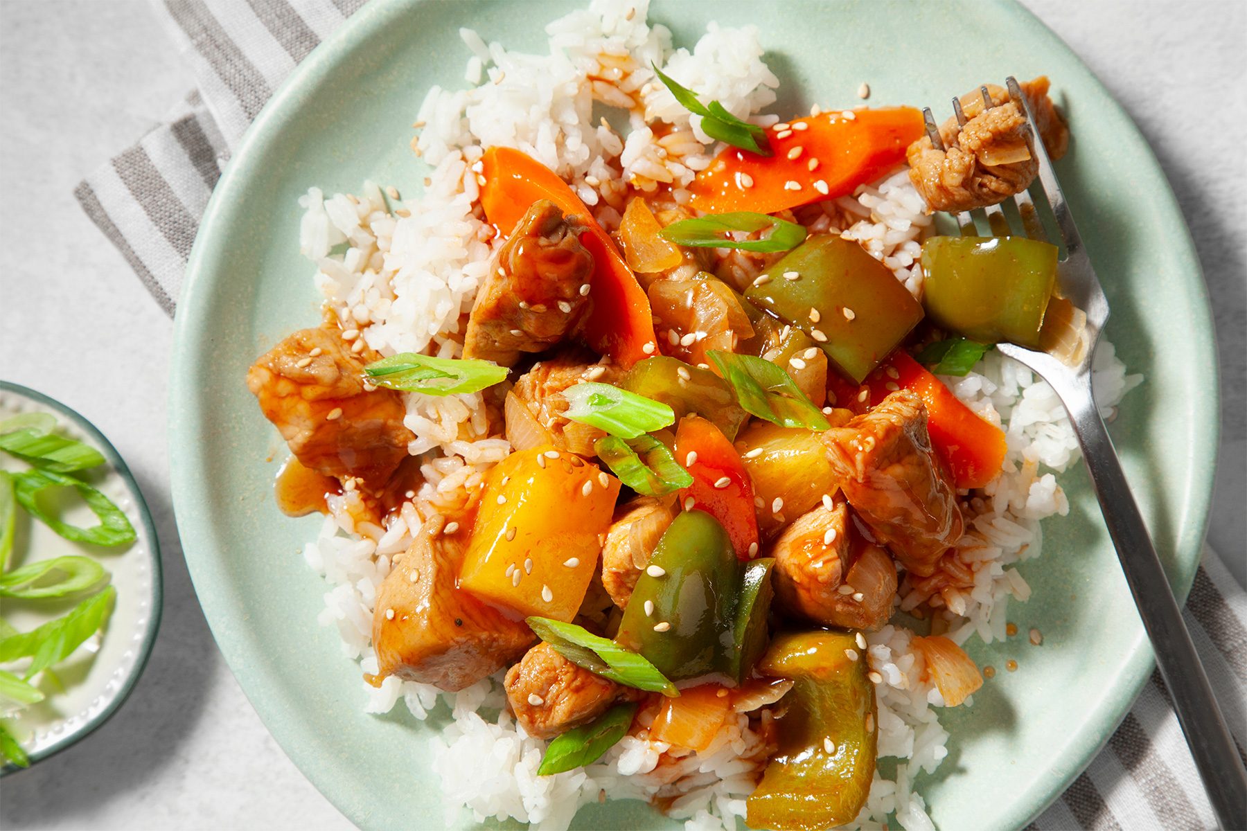 overhead shot of sweet and sour pork with rice