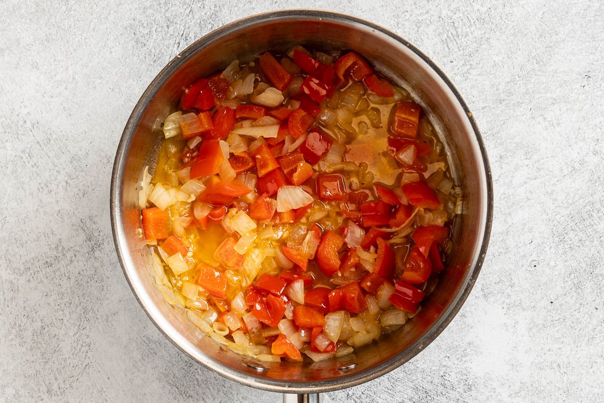 Taste of Home Cajun Mac and Cheese photo of sauteed veggies in the saucepan.