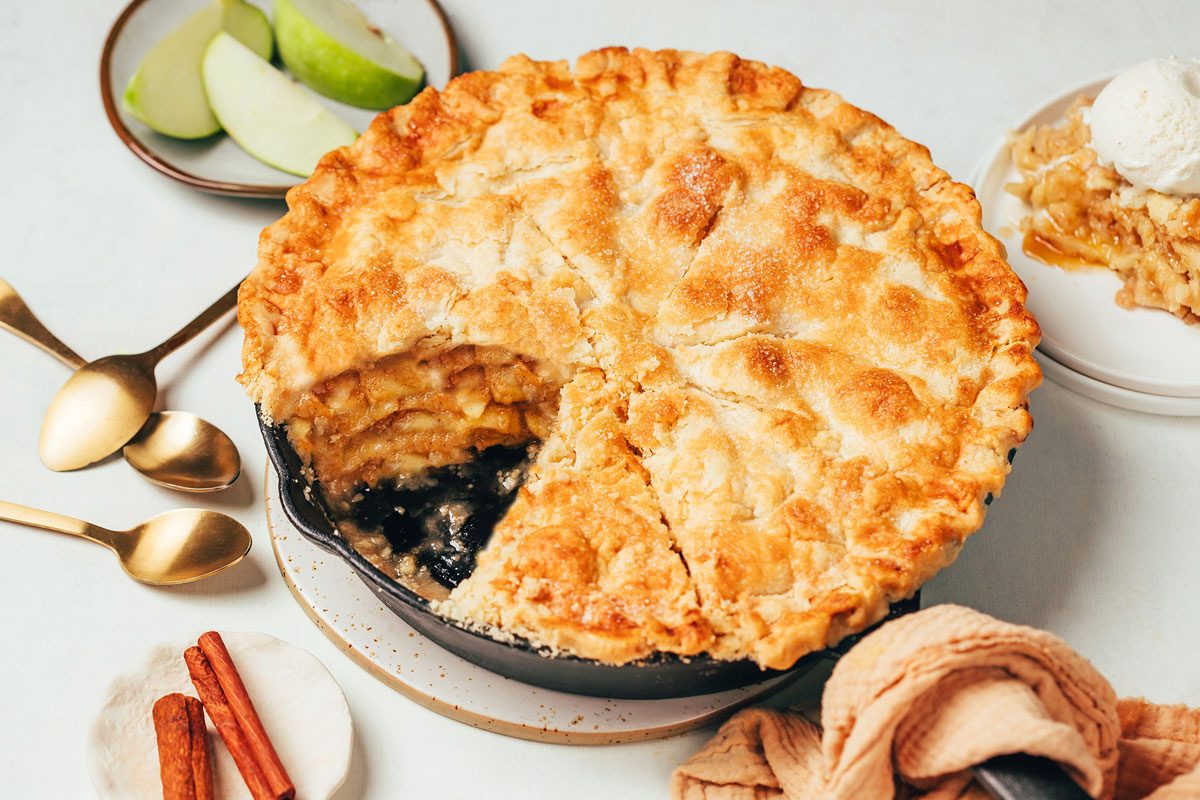 Cinnamon Apple Pie recipe by Taste of Home in a large cast iron skillet with a slice removed