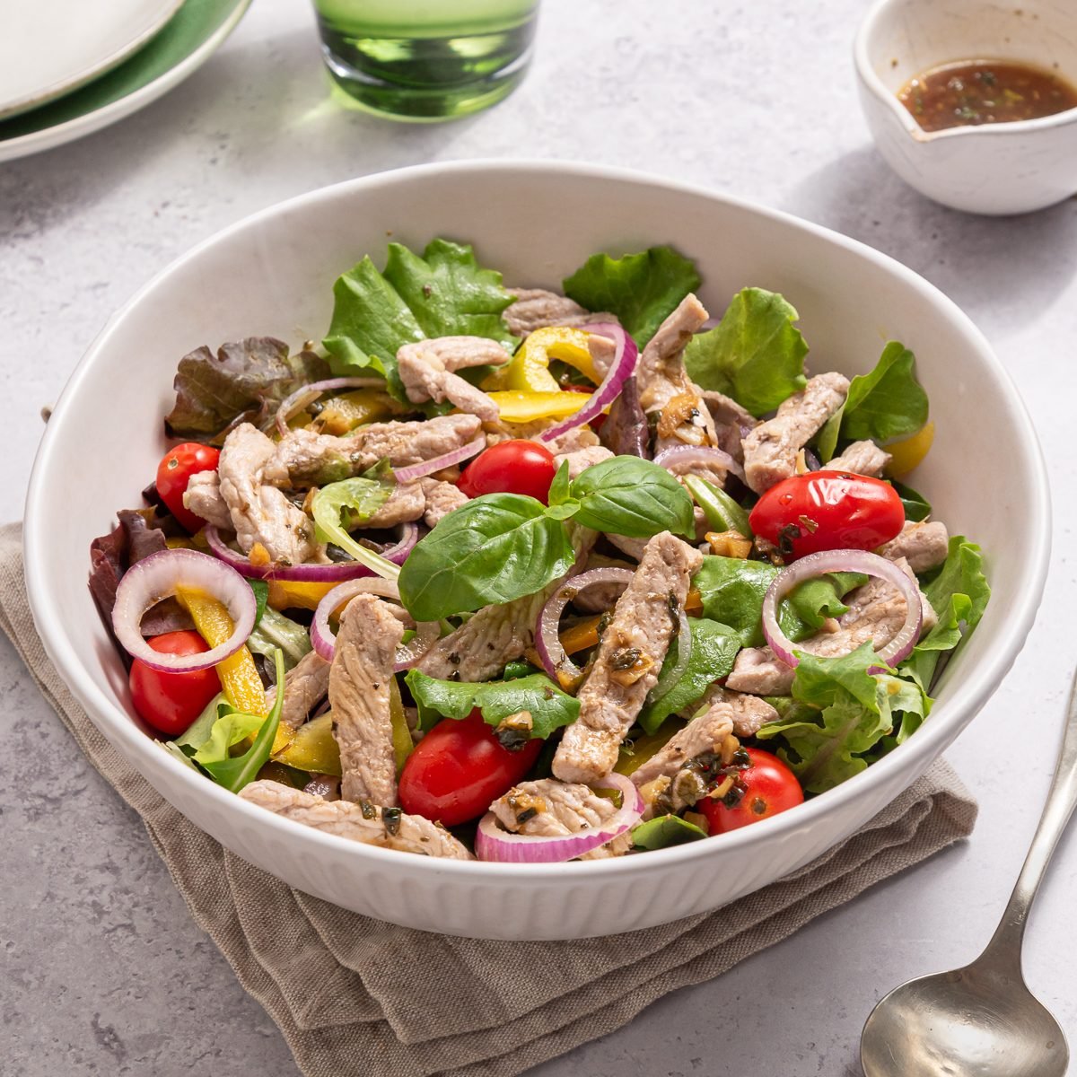 Pork Salad Inside White Bowl With Dressing