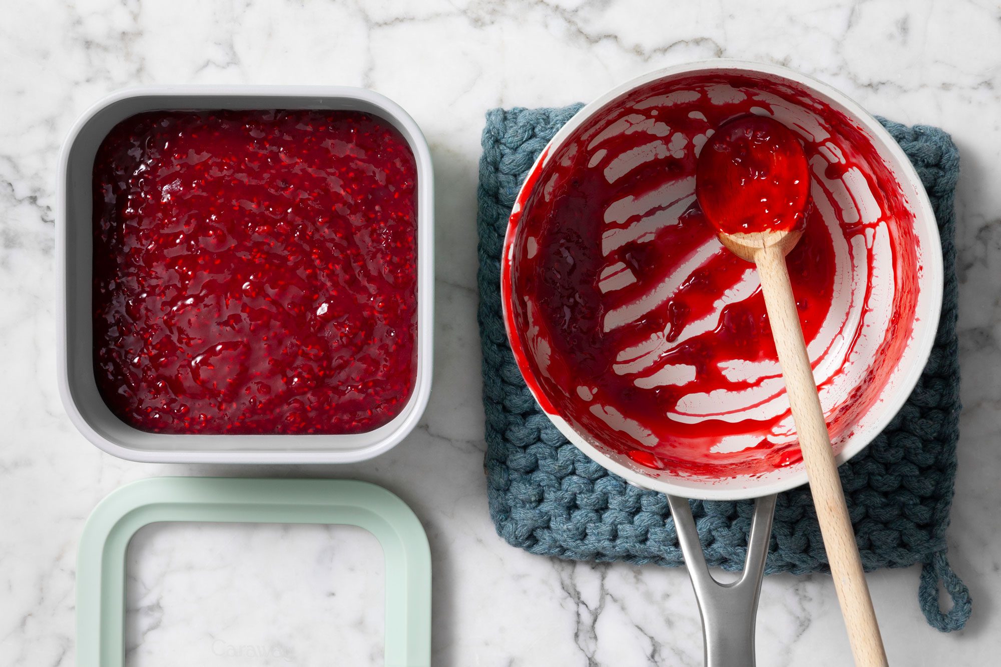 Two containers of raspberry jam